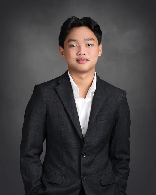 Jun Rey Ligutom, founder of JL Digital, in a dark blazer and white shirt